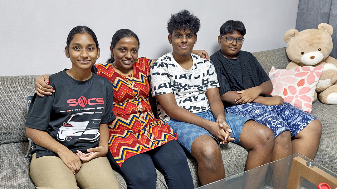 Single-mother Lydia Indranee (in red) with her three children.