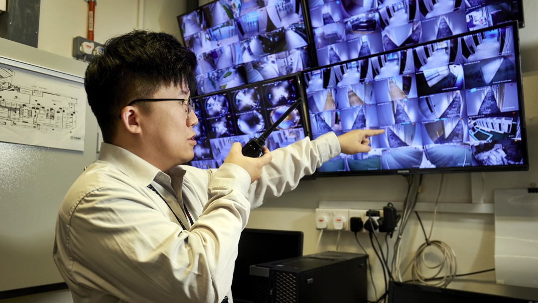 Security Supervisor Benjamin Tay monitoring CCTV systems as part of his security duties.