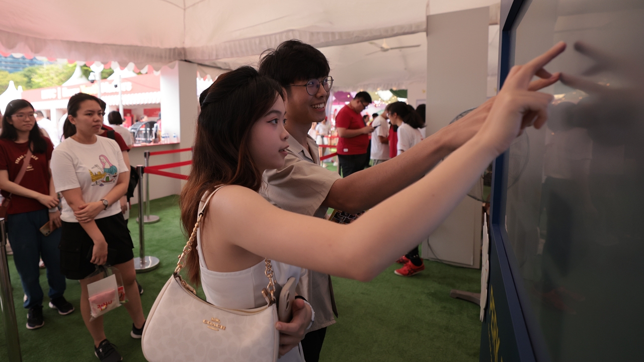 Photo 10a (Attendees at the NTUC Booth's Games) 1 1280.JPG