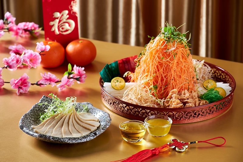 an arrangement of a Yu Sheng with Chinese New Year decorations