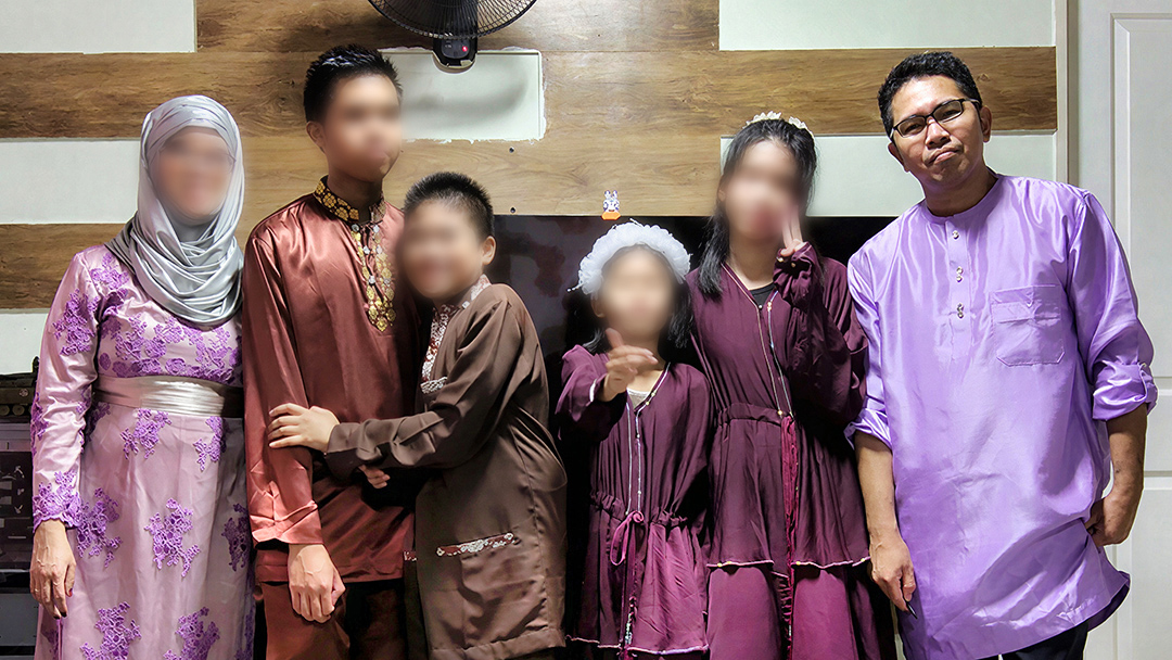NTUC Care beneficiary Isham Abdul Latif with his wife and four children.