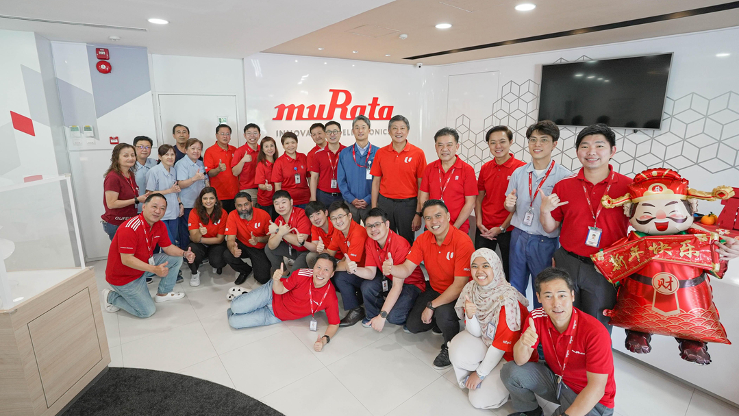 A group of people posing for a photo at Murata Singapore.