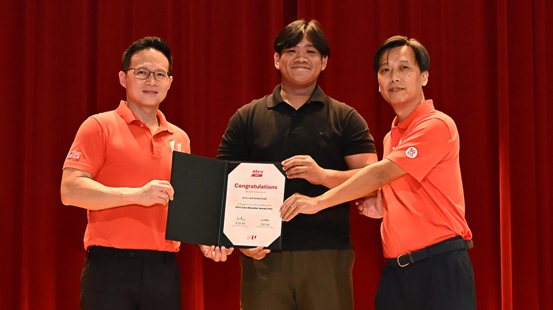 Nanyang Technological University student Tan Jin Long (centre) receiving the NTUC Care (Education Awards) on 17 October 2026.