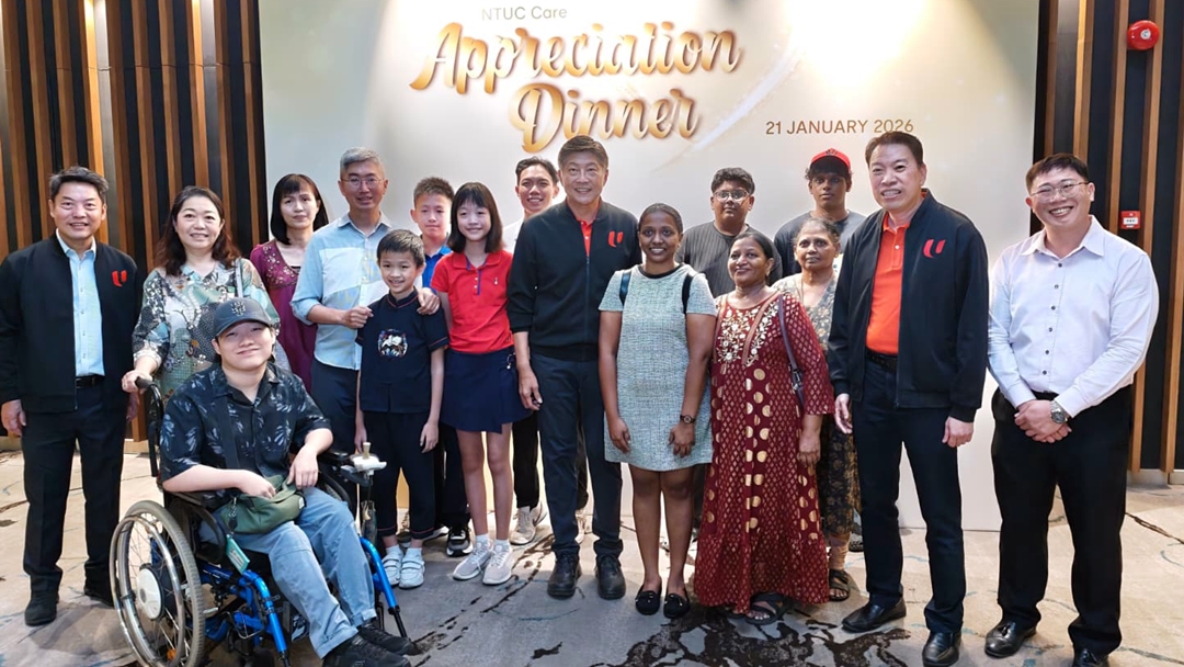 NTUC Secretary-General Ng Chee Meng with beneficiaries of NTUC Care assistance programmes.on 21 January 2026.NTUC Appreciation Dinner 2026.jpeg