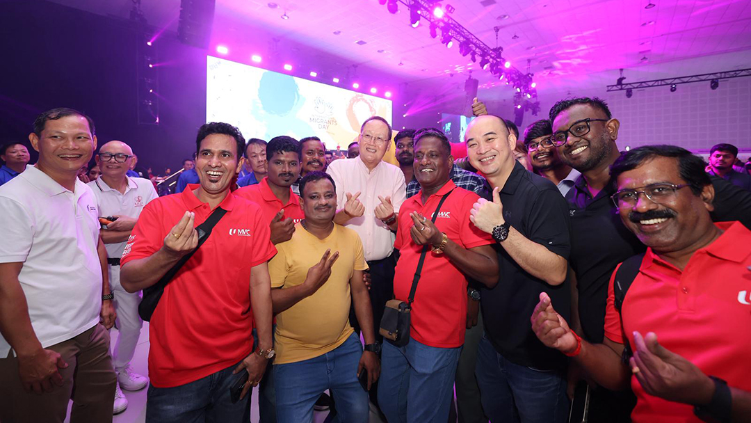 Migrants workers celebrating at the International Migrants Day 2025 event.