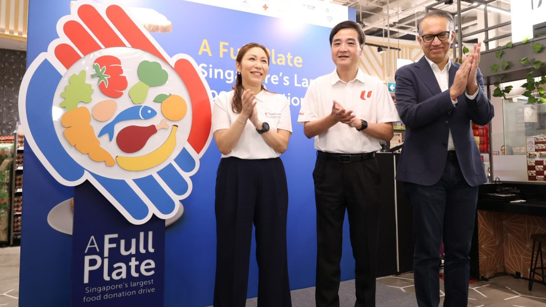 FairPrice-Foundation-General-Manager-Jean-Khong-NTUC-Deputy-Secretary-General-Heng-Chee-How-and-FPG.jpeg