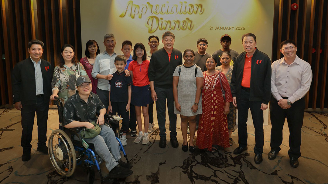 NTUC Secretary-General Ng Chee Meng with beneficiaries of NTUC Care assistance programmes.on 21 January 2026.