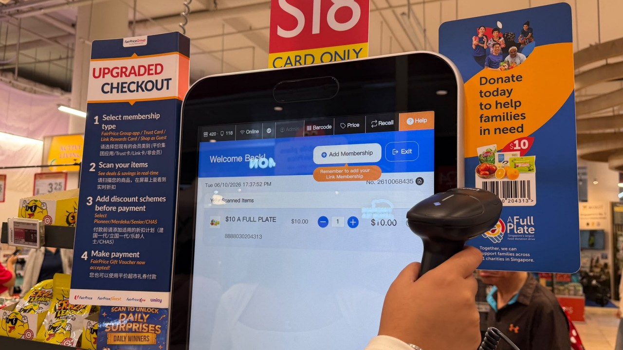 Customer scanning bundle barcode at FairPrice self-checkout counters 1280.jpeg